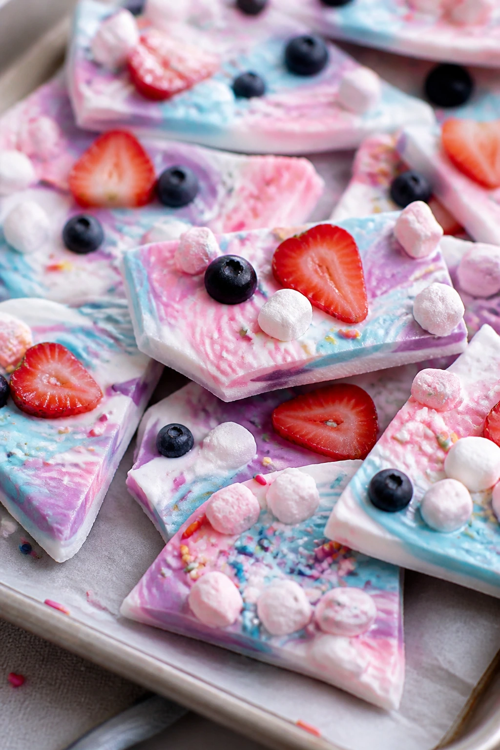 Pastel yogurt bark shards with fruit and marshmallows